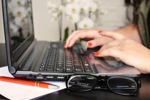 Typing on a laptop
