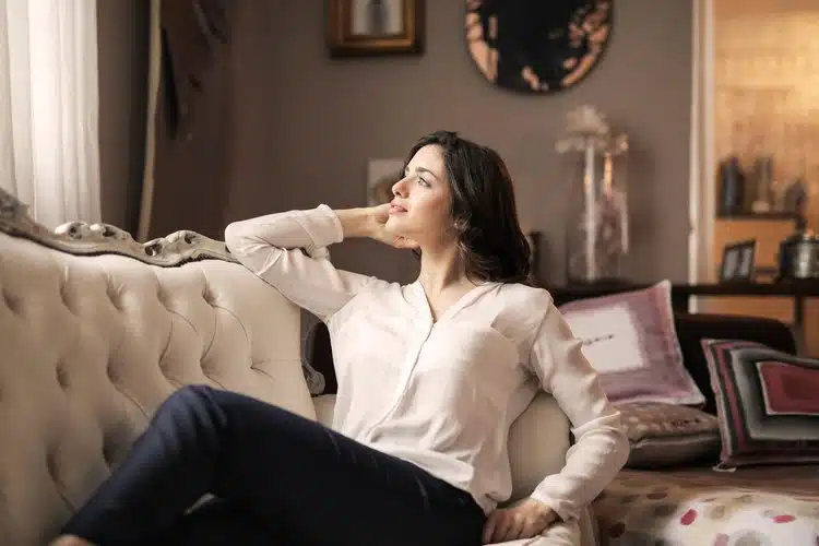 therapy+session smiling woman relaxing on a sofa