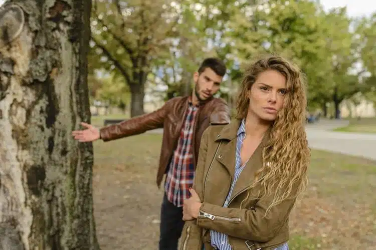 Couple arguing in a park