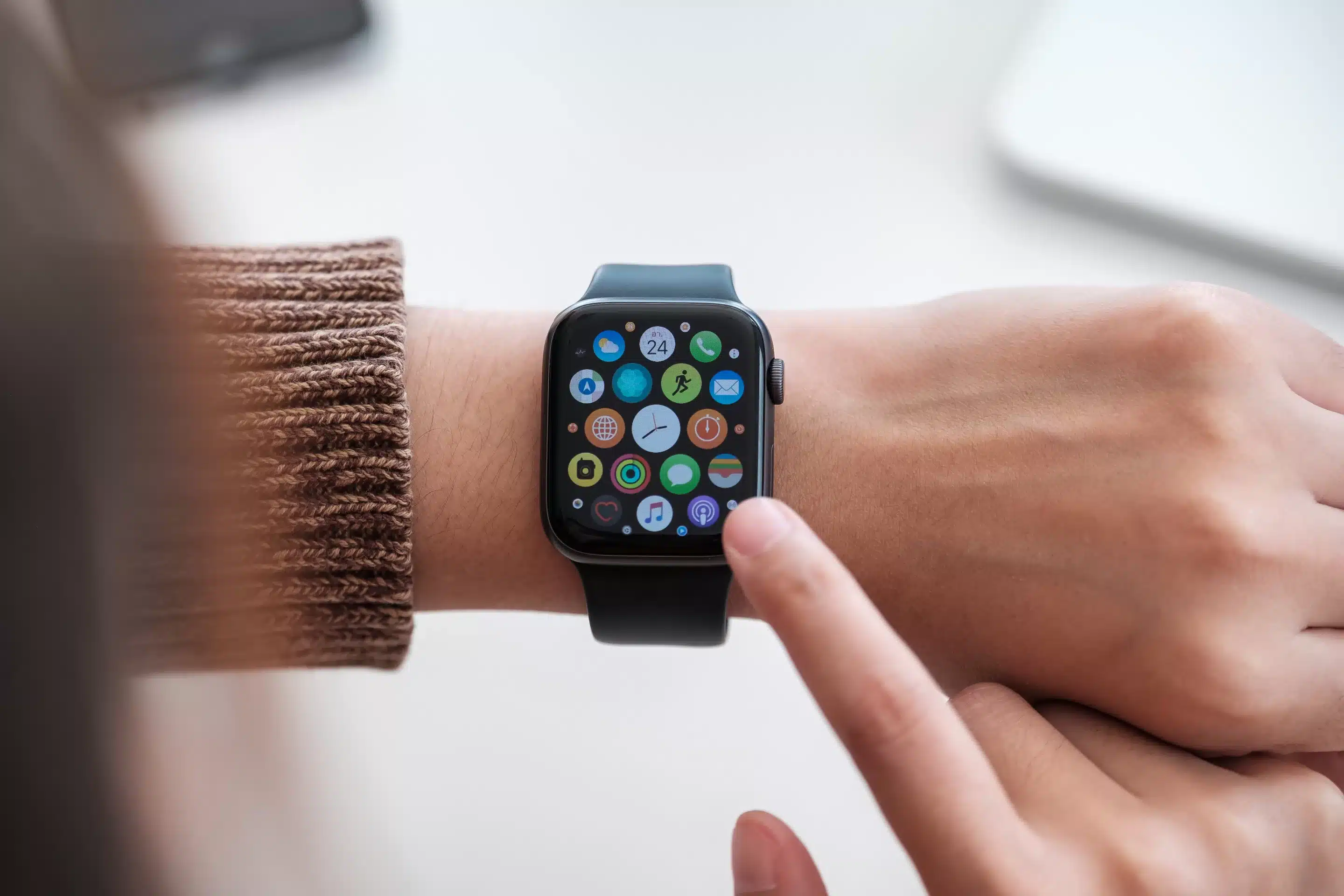person clicking Apple Watch smartwatch