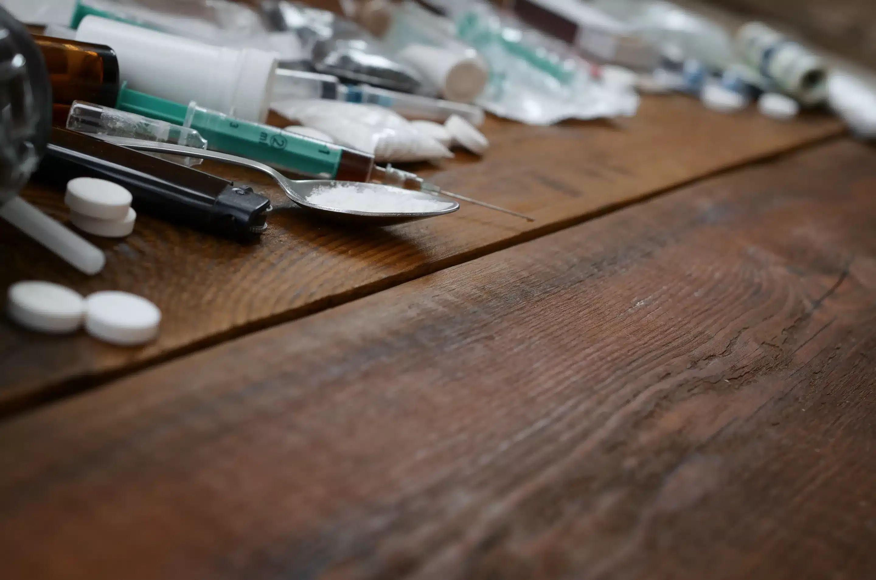 a spoon and syringes on a table