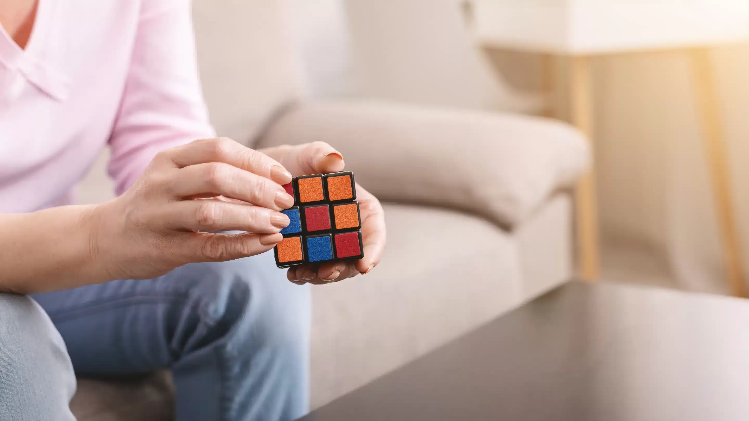 Person with adhd distracted by rubik's cube
