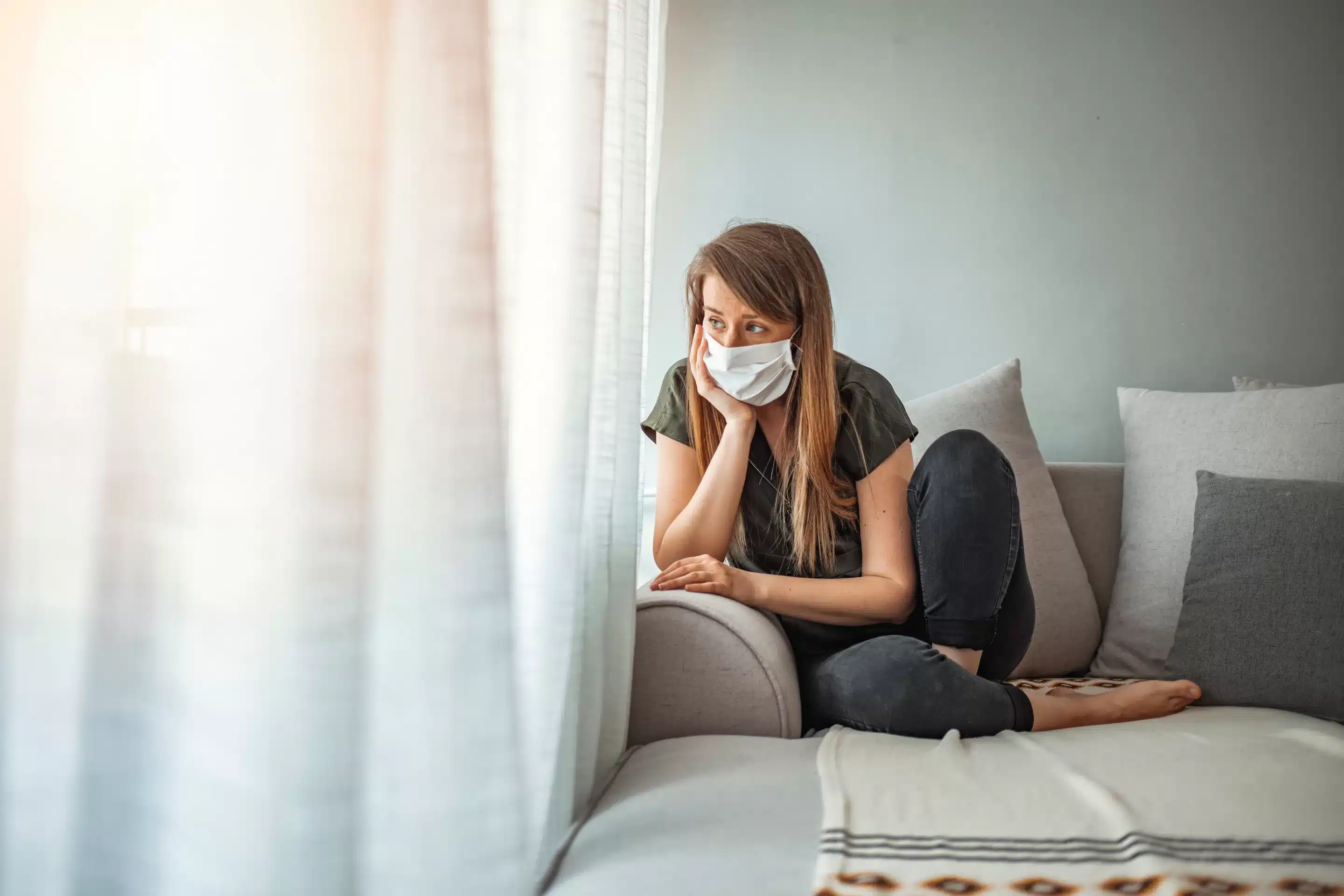 Woman in isolation at home for virus outbreak. Young woman in isolation at home