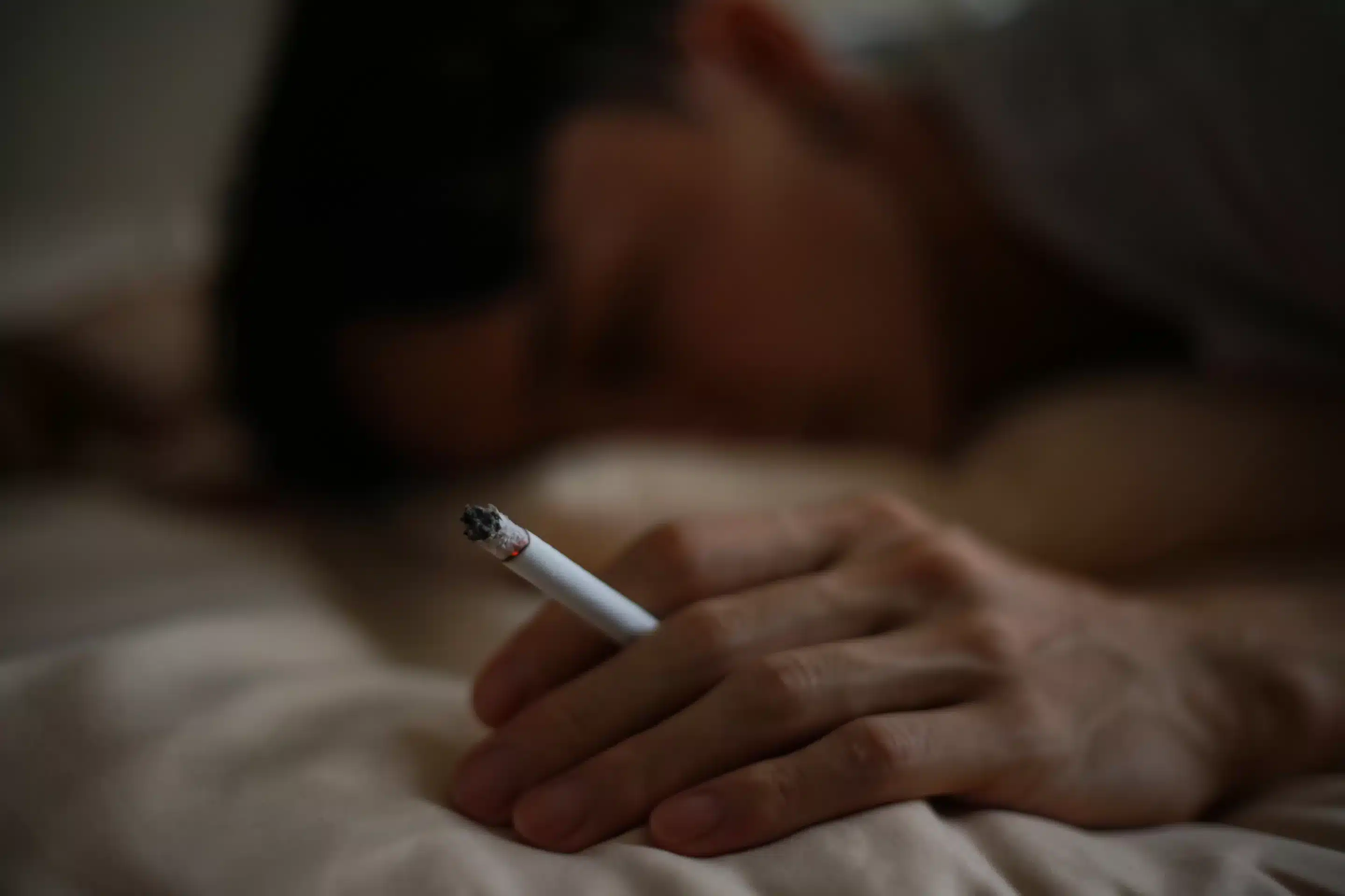 Image of a man smoking a cigarette