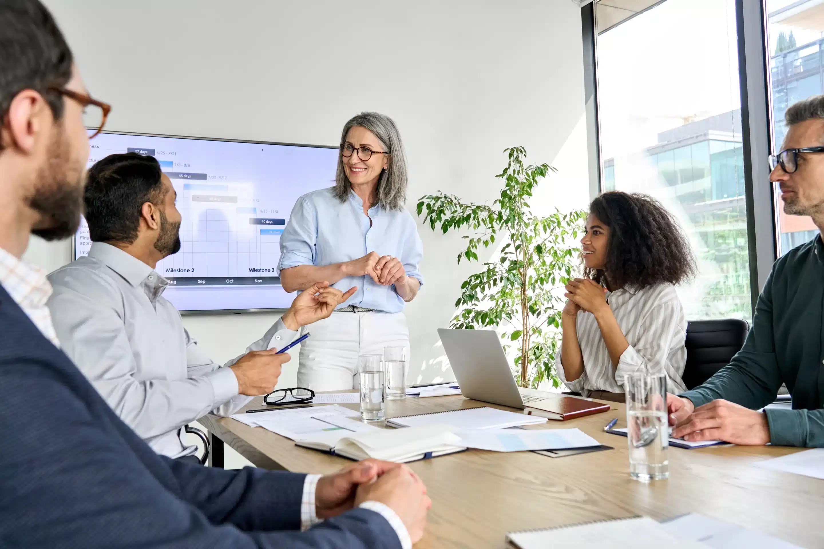 Coworkers around a table discussing the Private Practice Intake Process