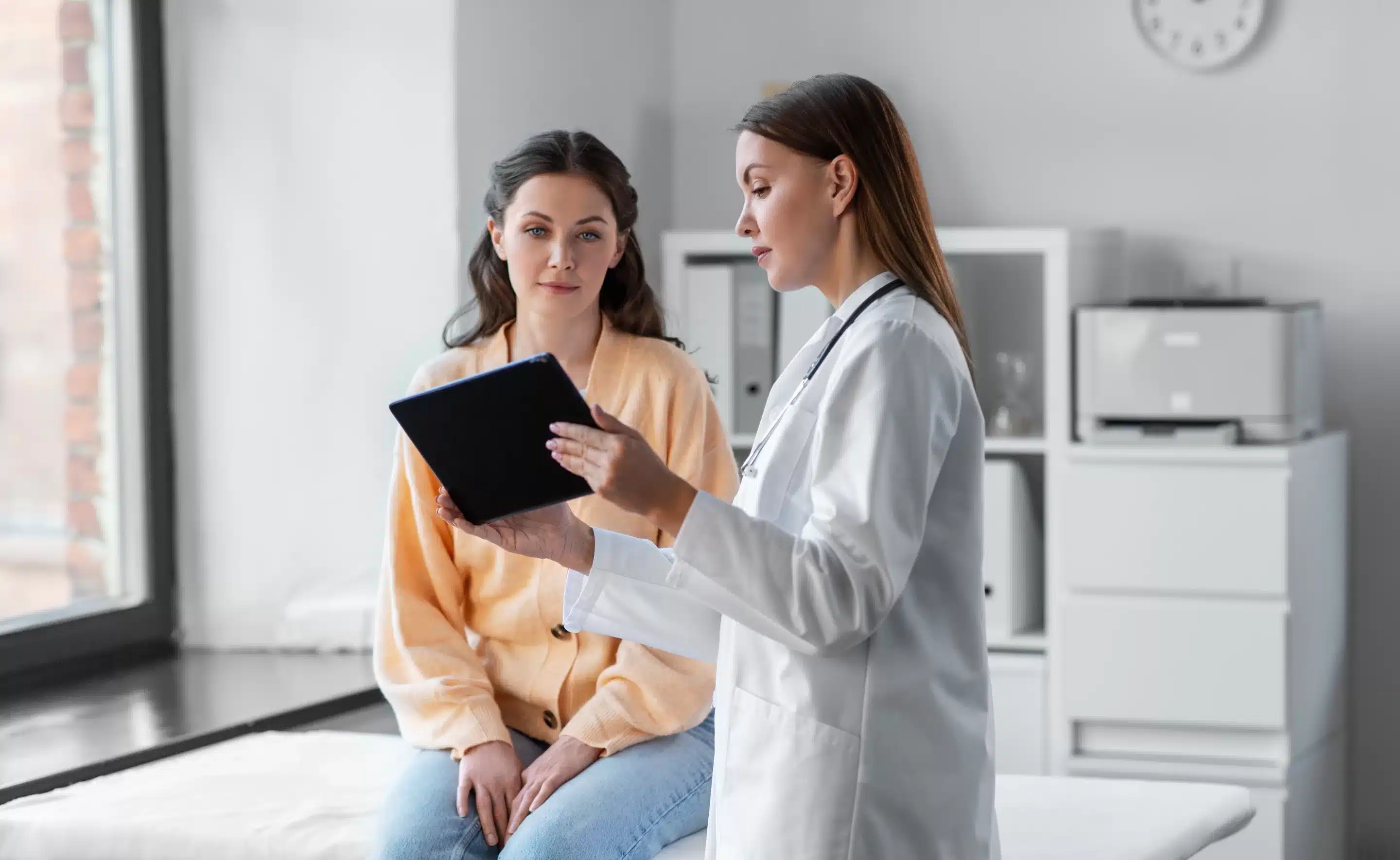 medicine, healthcare and people concept - female doctor with tablet pc computer