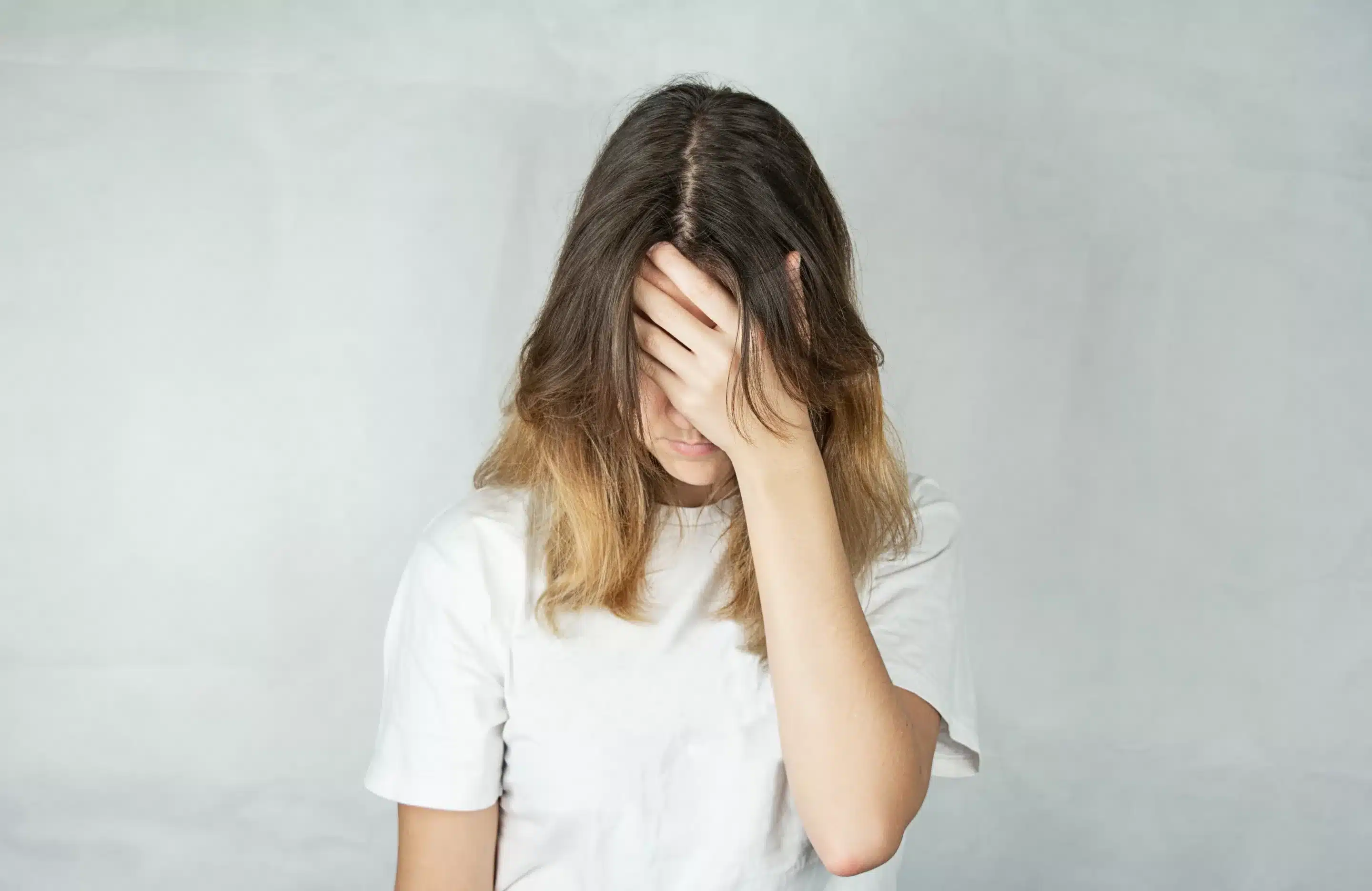 Sad young woman with a pensive and irritated face. Anxiety Disorders