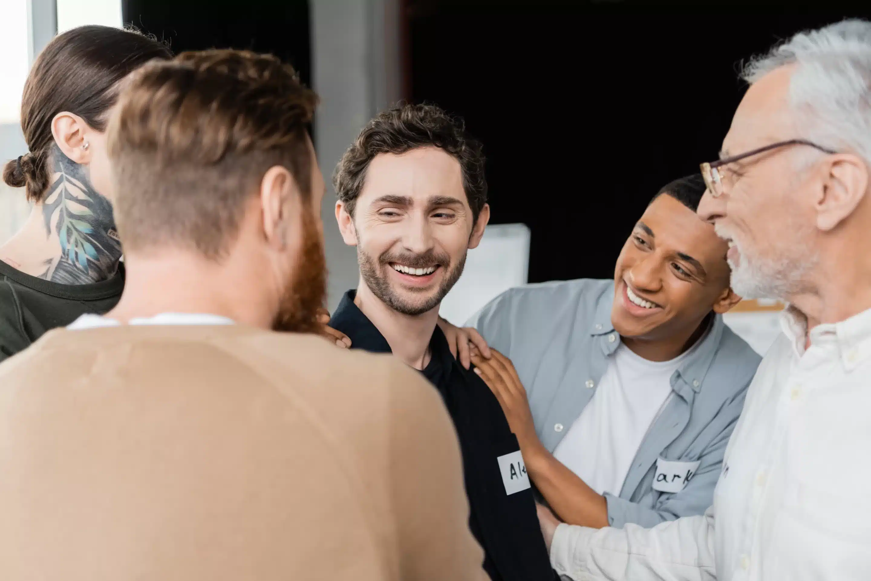 a group of men smiling