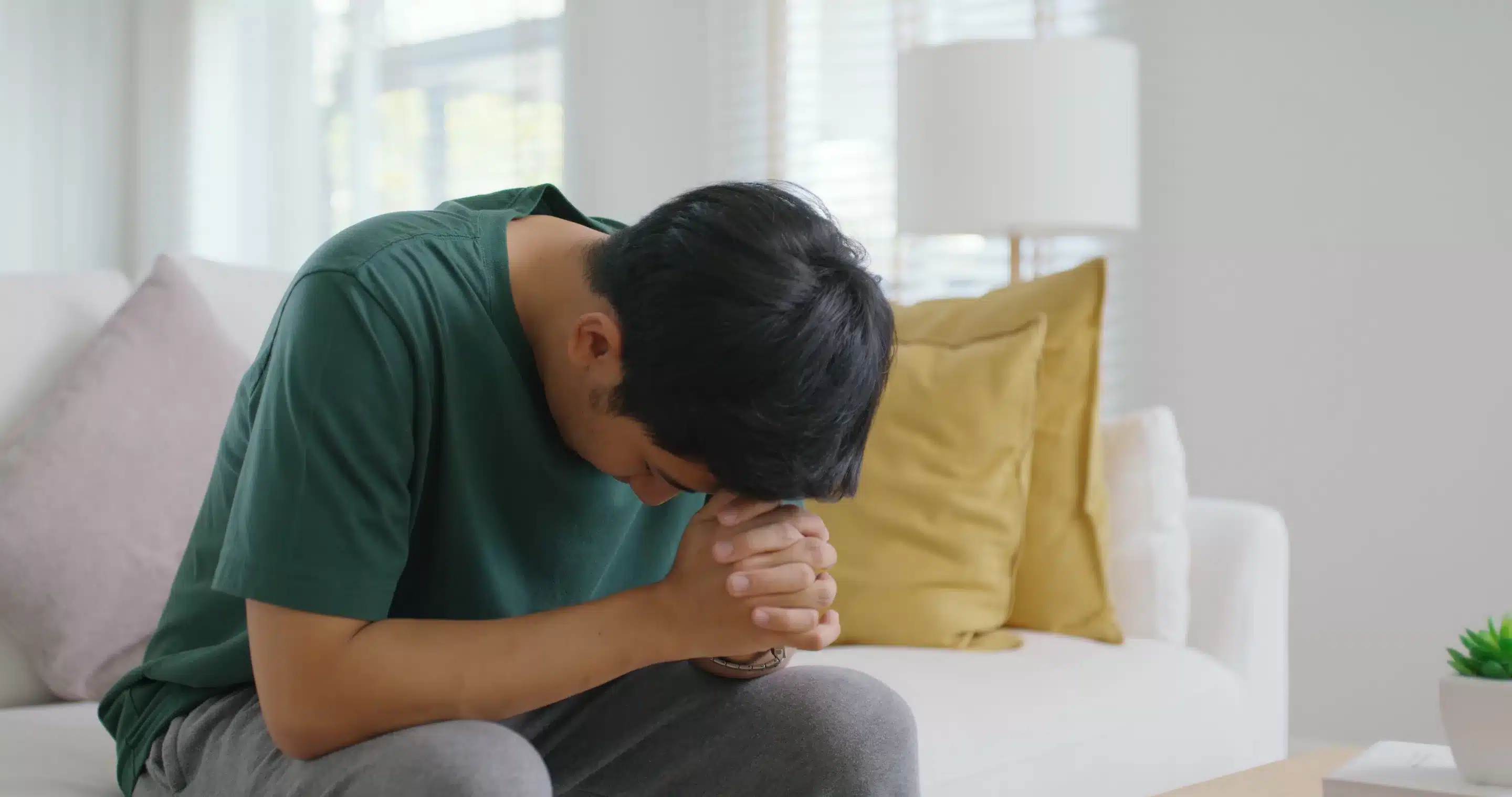 sia people young man upset head in hands think concern of job loss