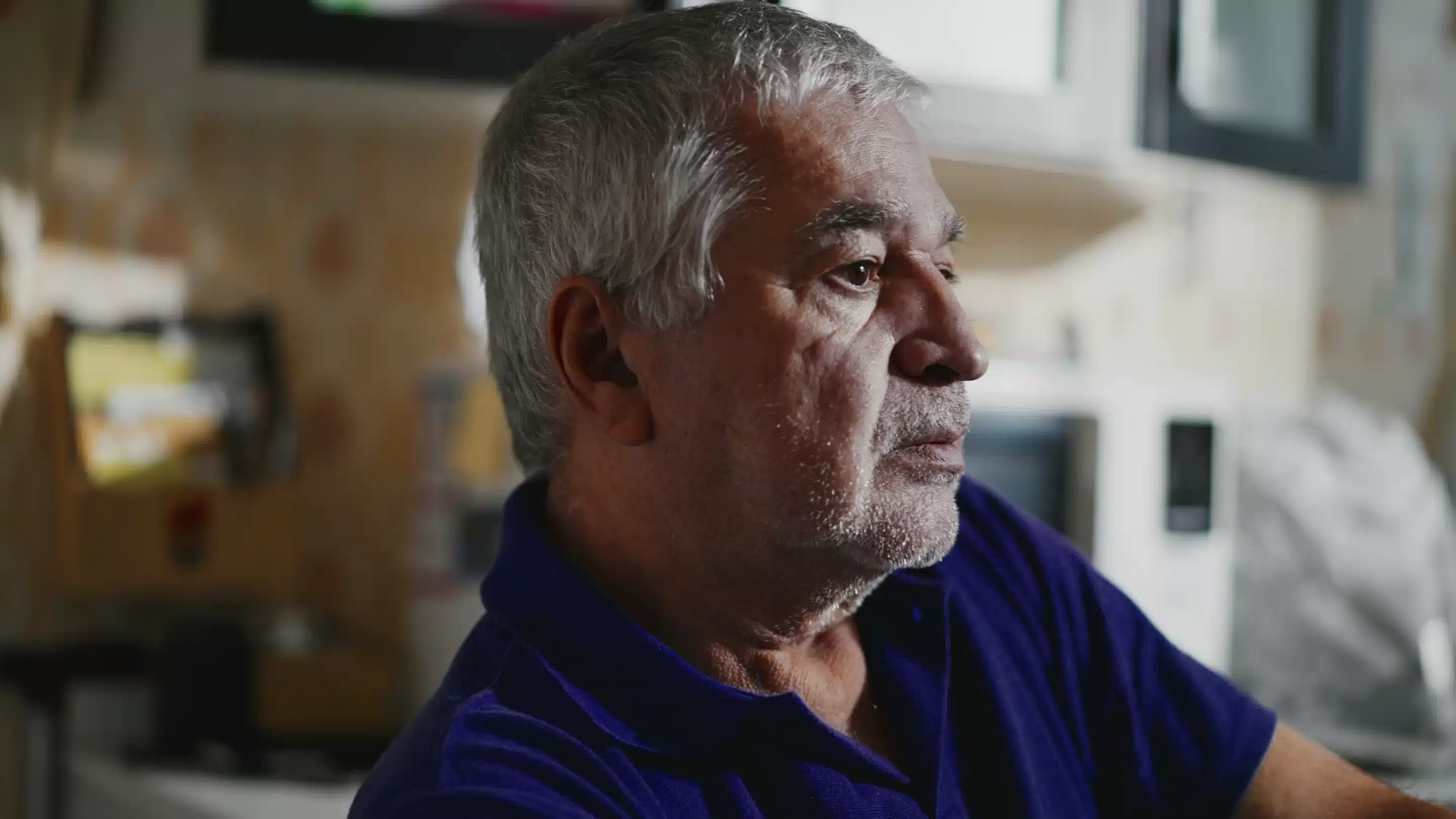Hopeless Senior Man in Quiet Despair at Home, Close-Up Depiction of Aging Face