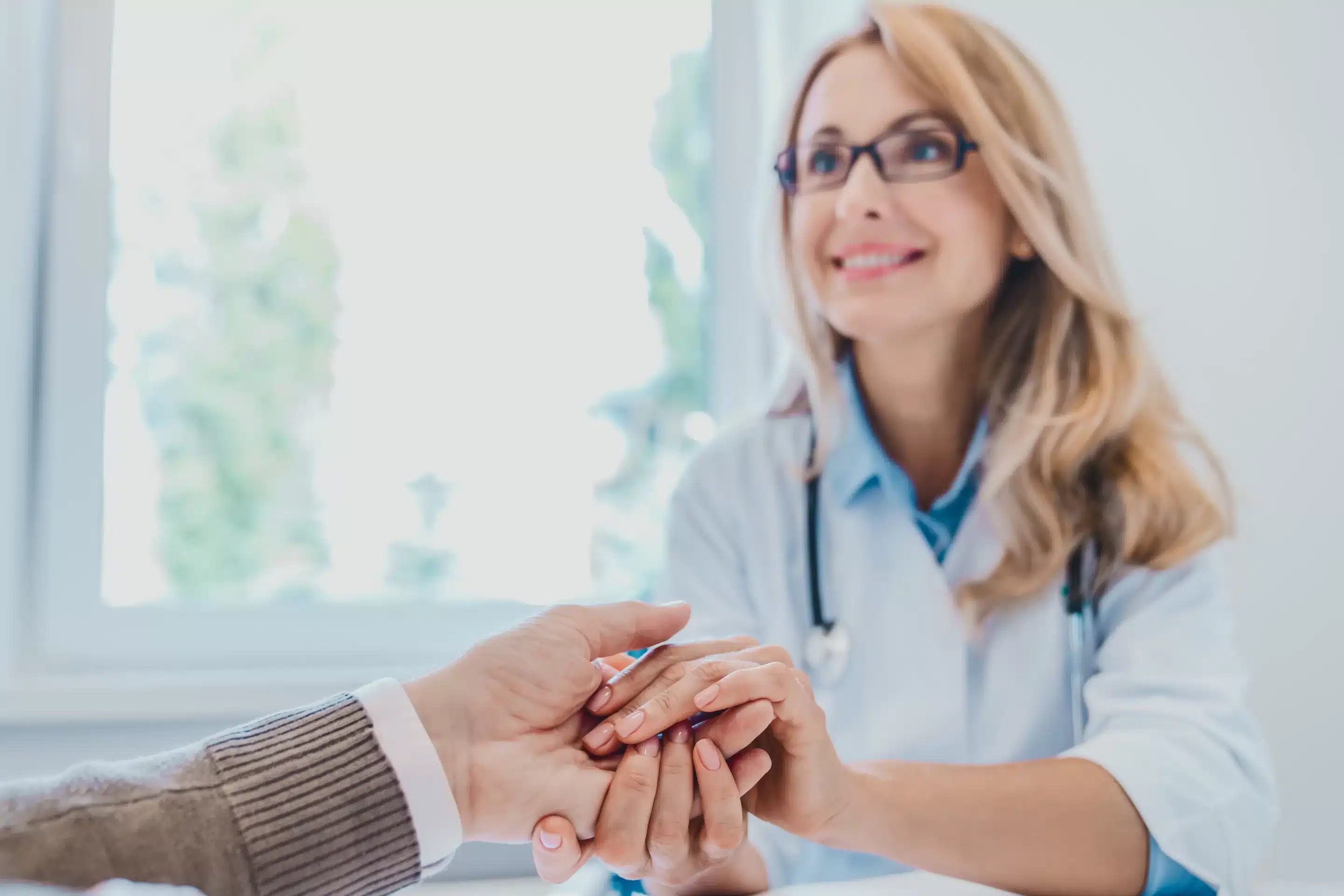 Helping hand concept. Doctor holding patient'