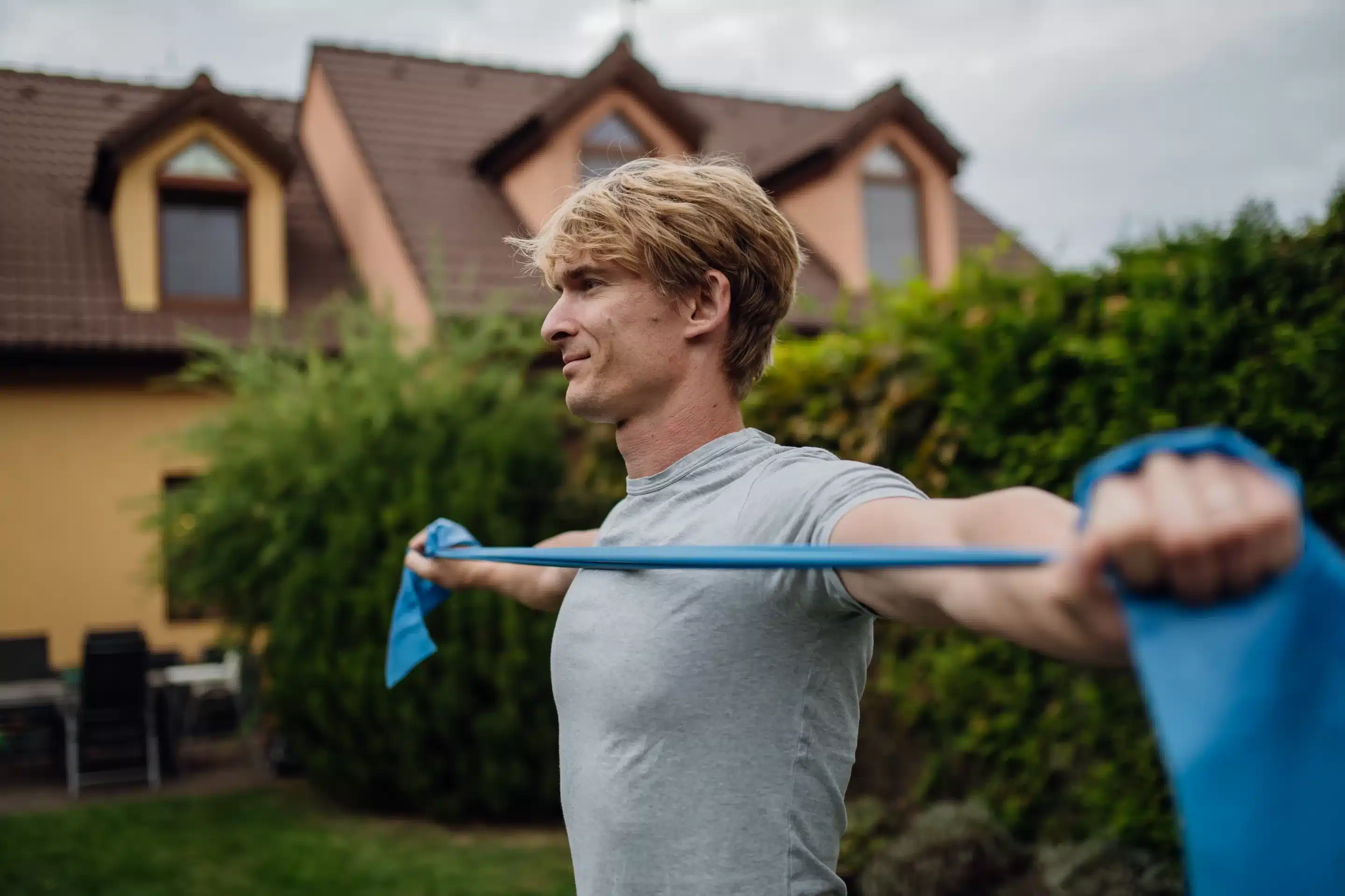 a man holding a blue band