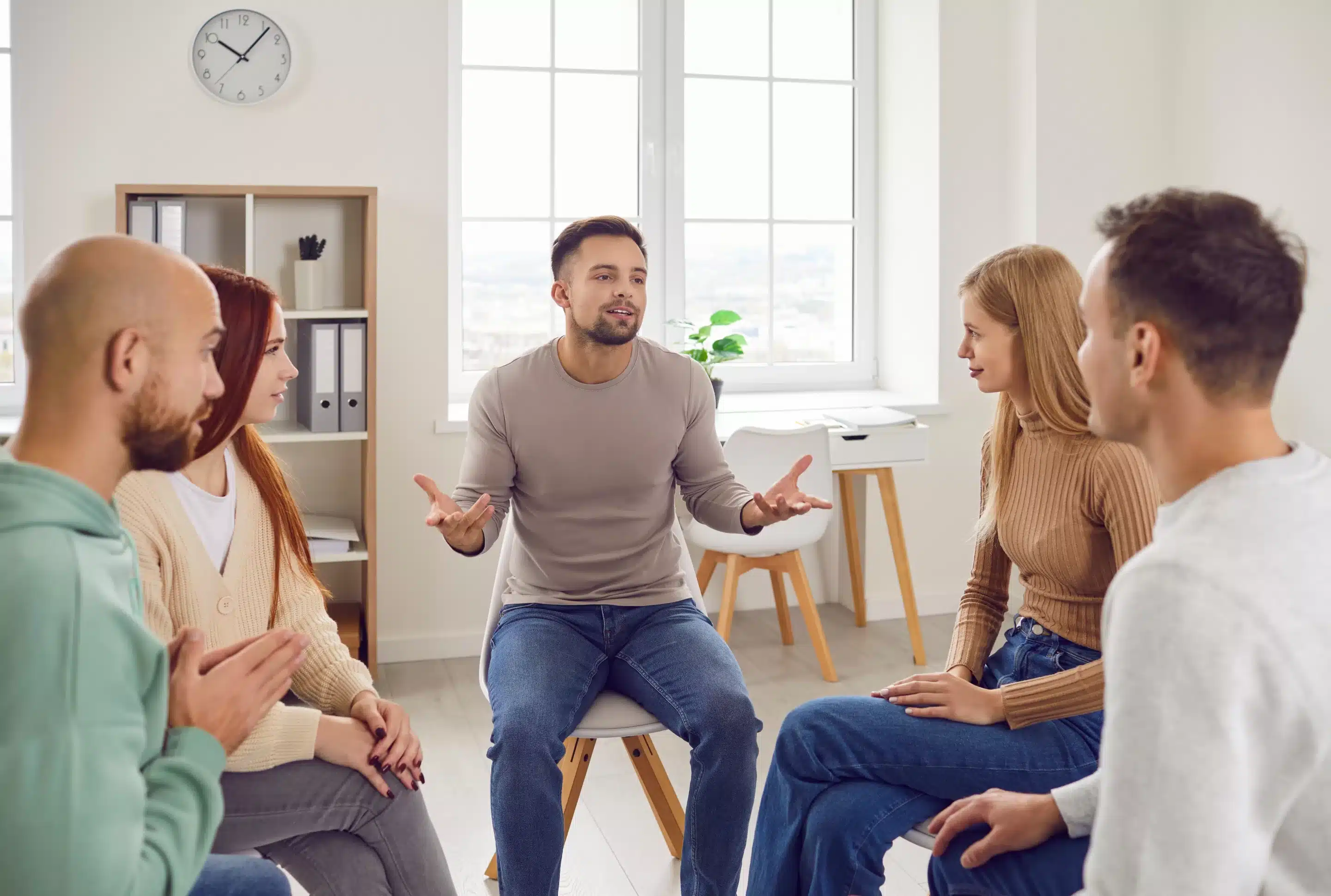 a group of people sitting in a circle