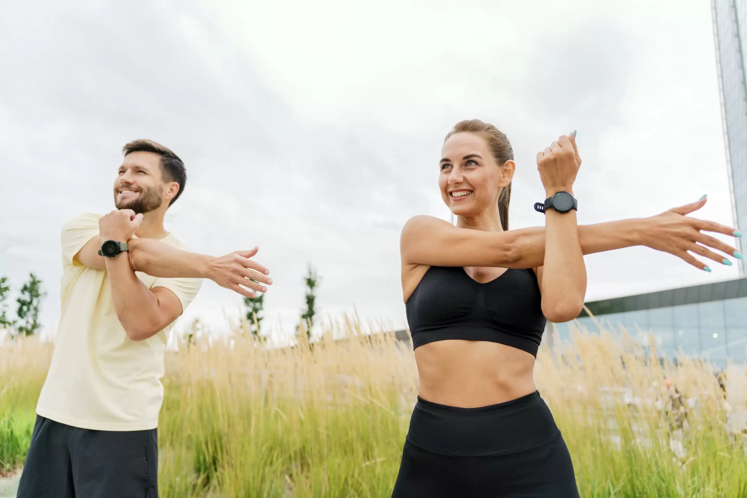 Smiling retired woman stretching legs outdoors. Senior woman enjoying