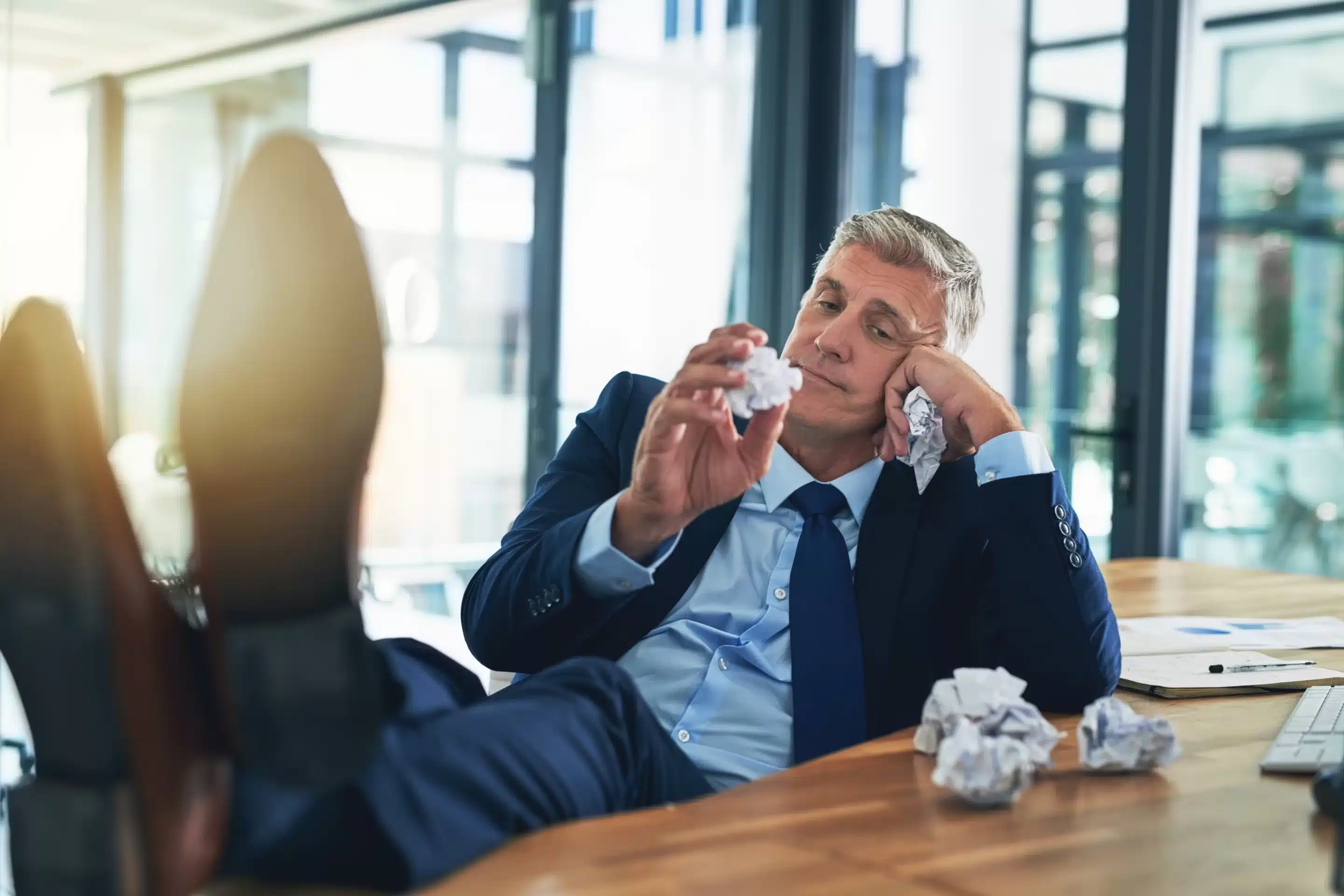Non-medication Treatments for ADHD (Inattention, Distraction, Procrastination) a man in a suit holding crumpled paper