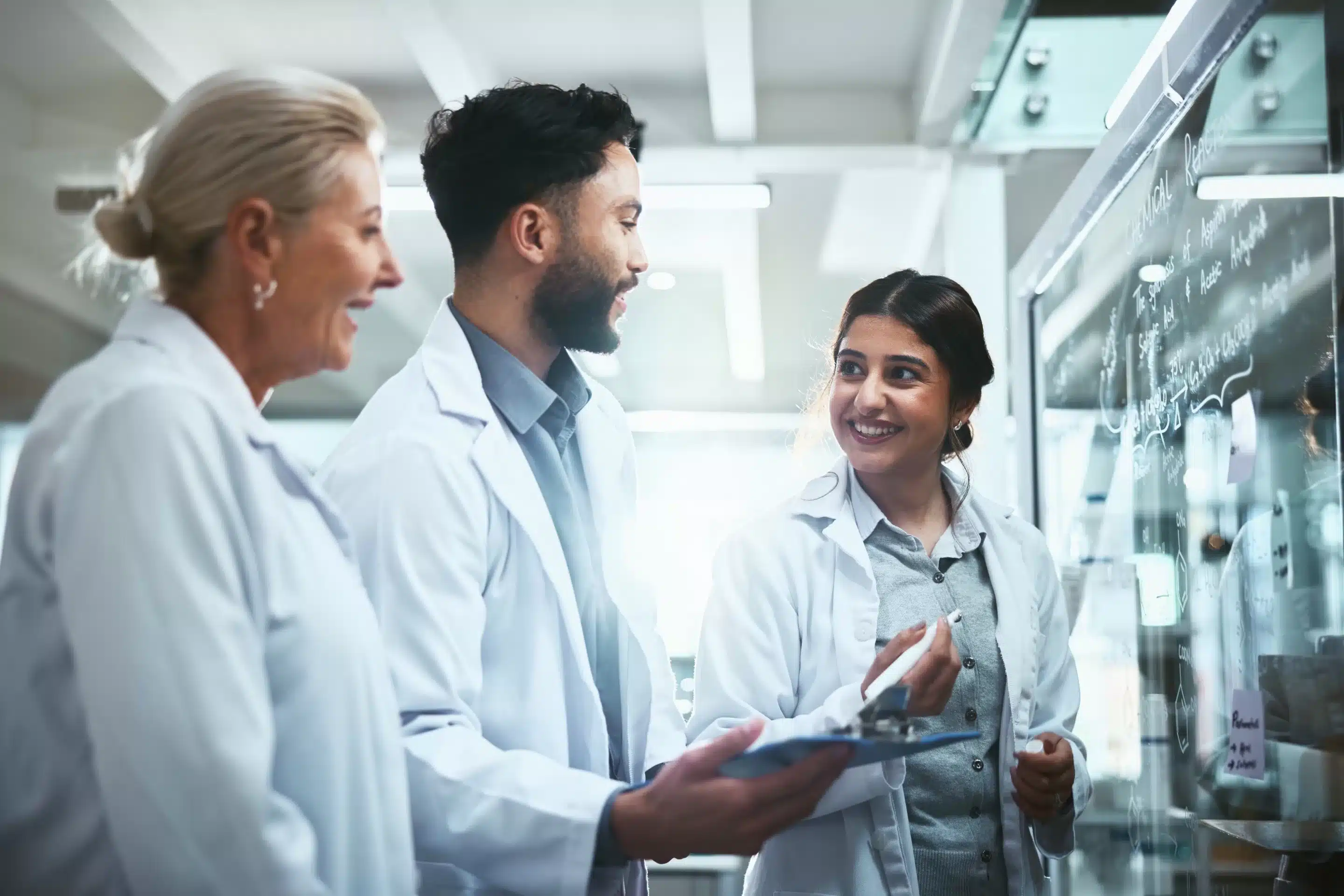 Meeting, glass wall and team of scientists in lab for pharmaceutical