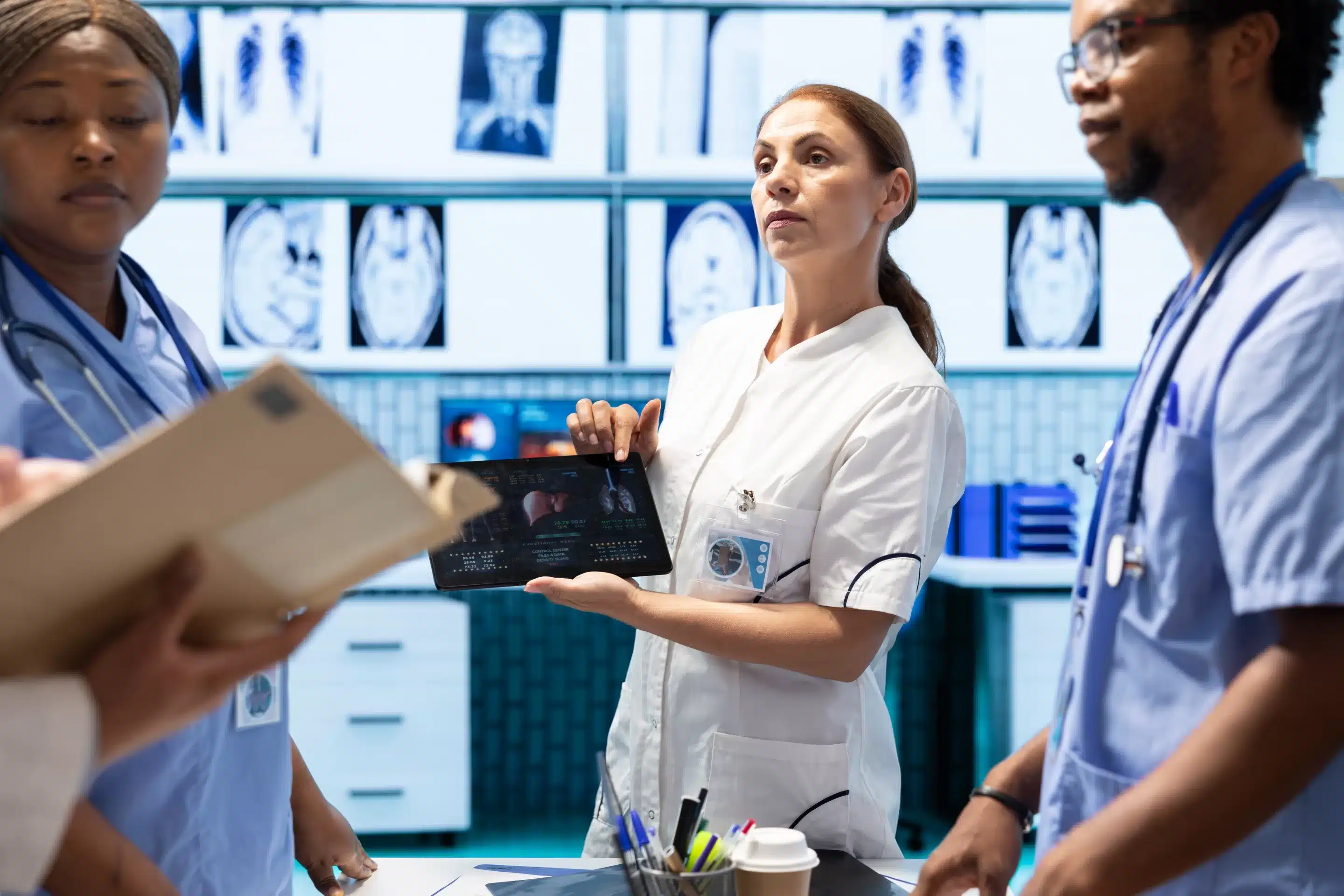 Diverse doctors team looking at radiography scan test result to check