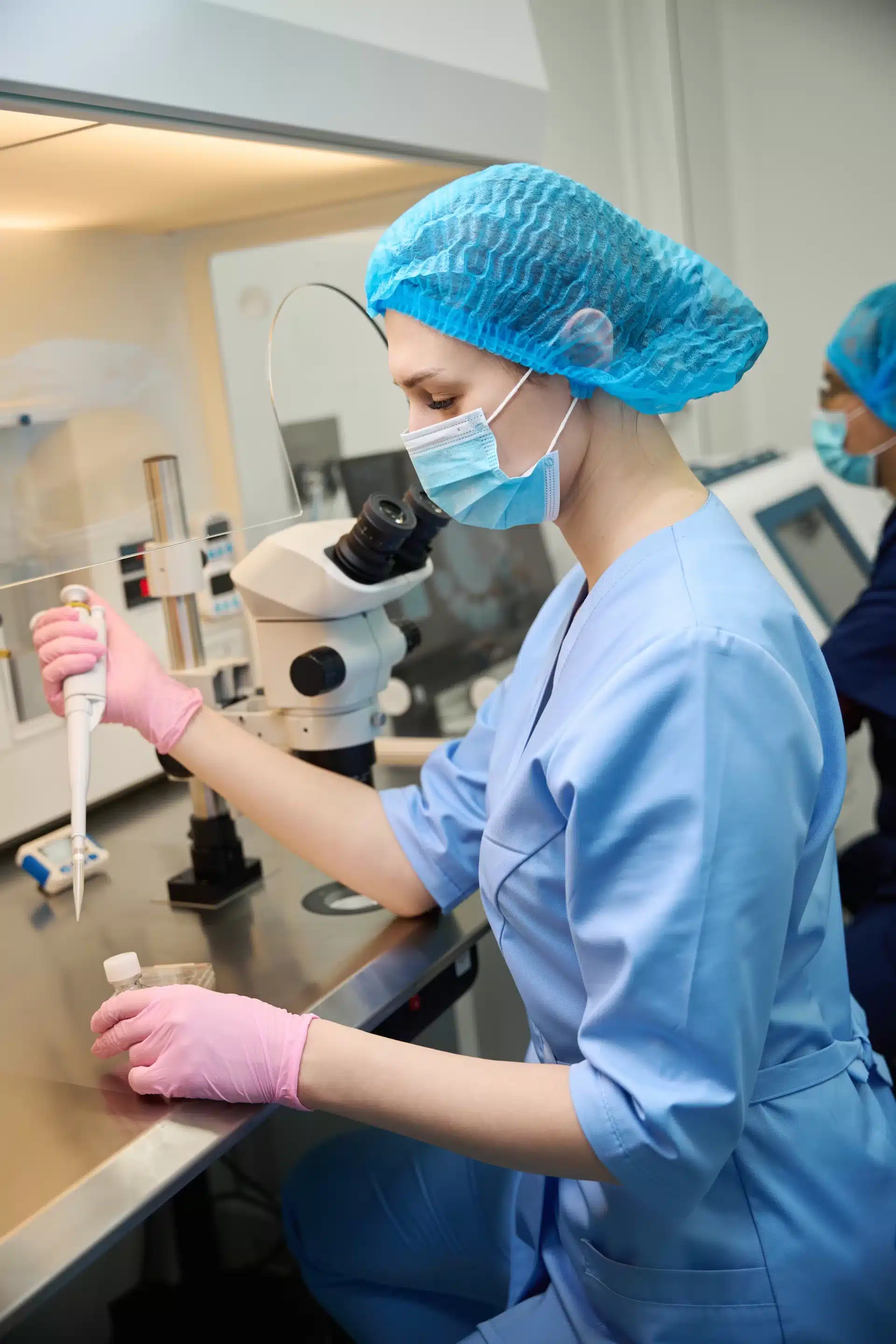 Embryologist conducting procedures under sterile laboratory conditions