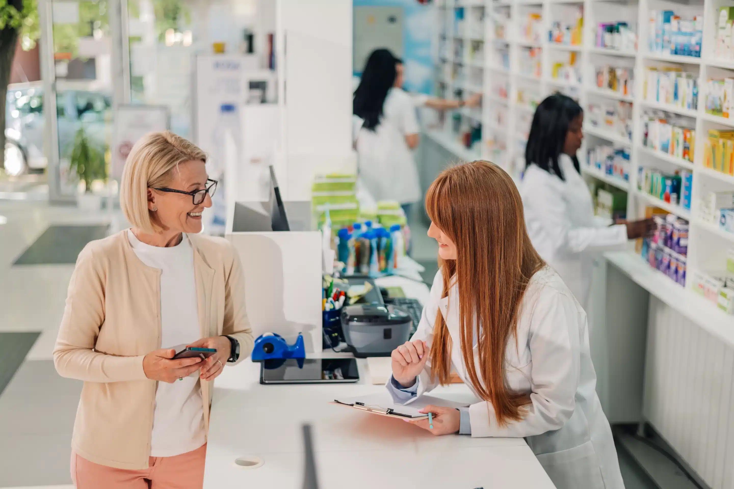 a woman and a woman in a pharmacy