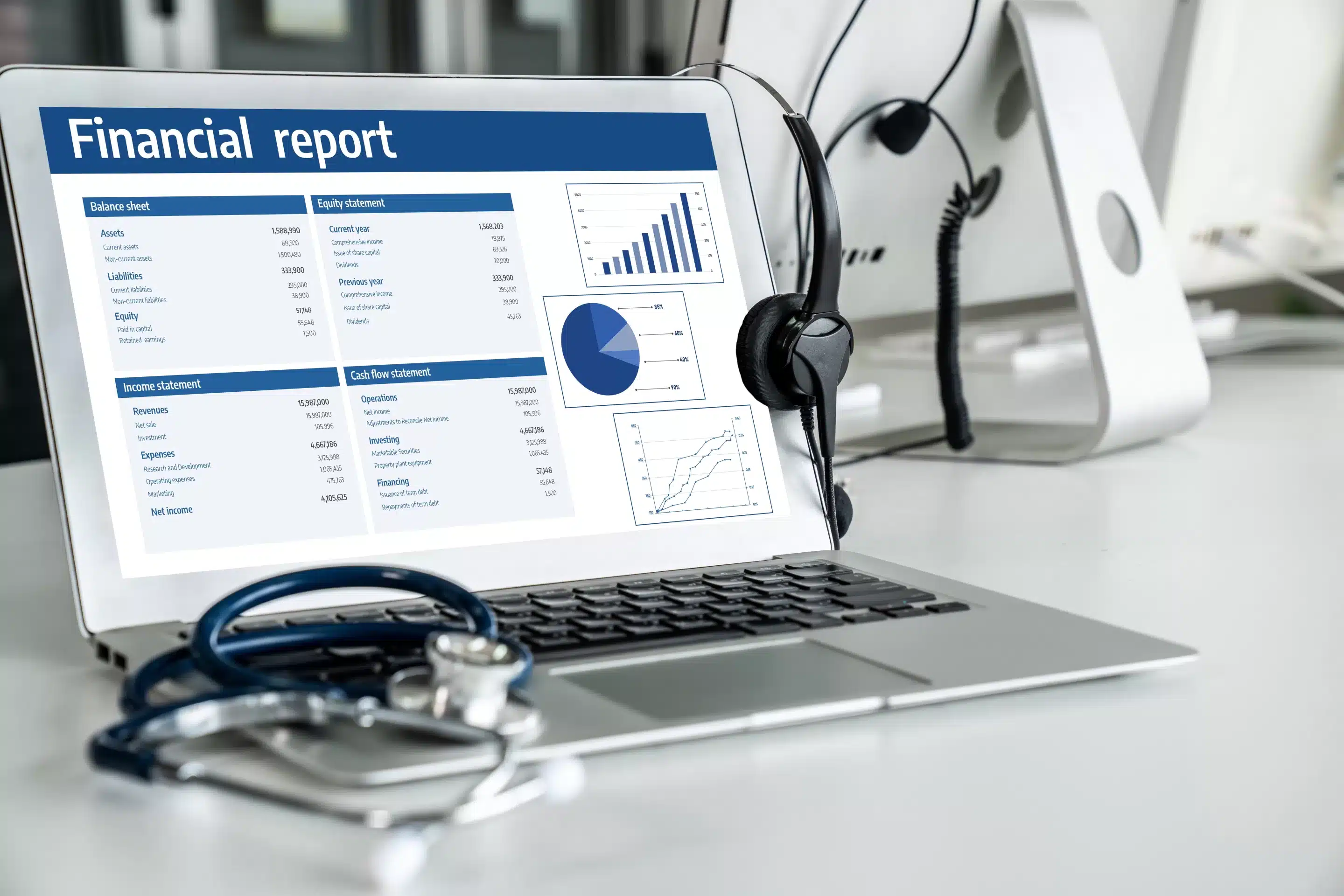 person sitting while using laptop computer and green stethoscope near