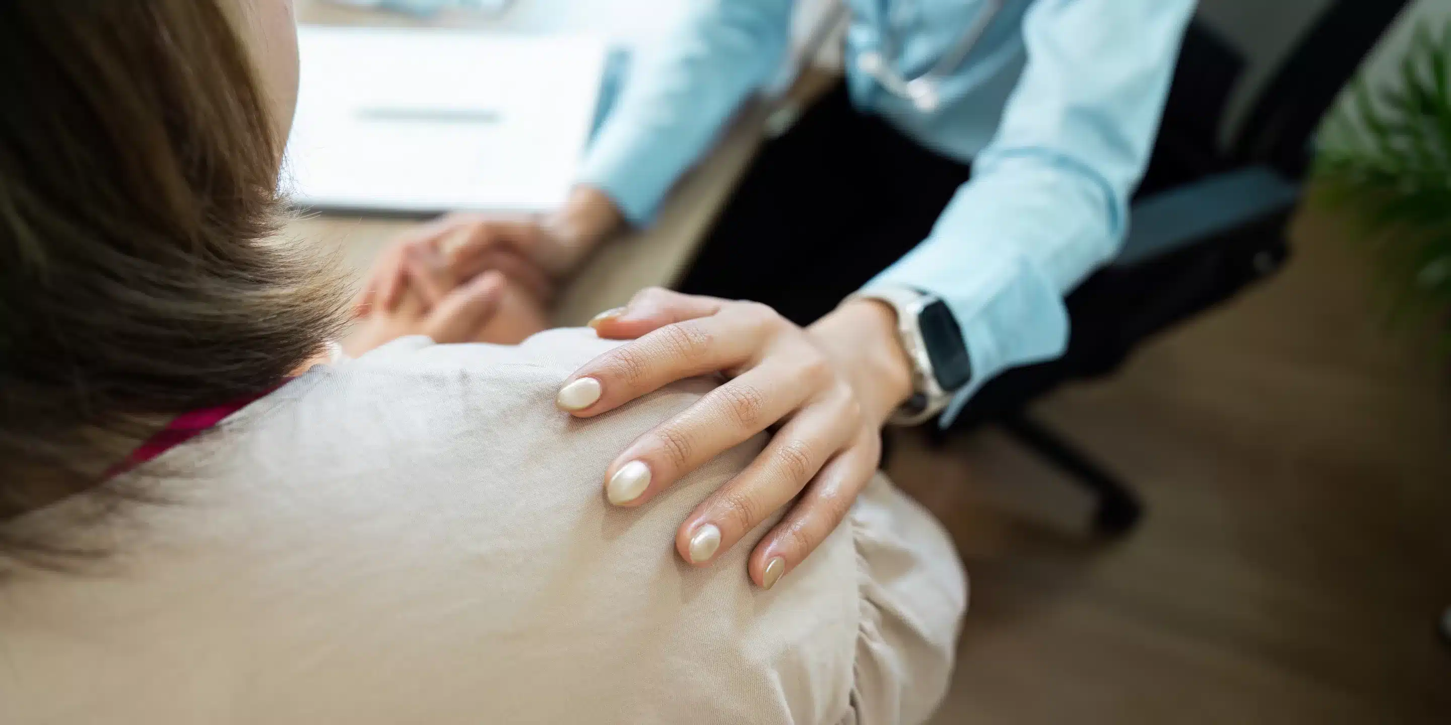 Emotional Support and Patient Care. A healthcare worker offers comfort to a patient