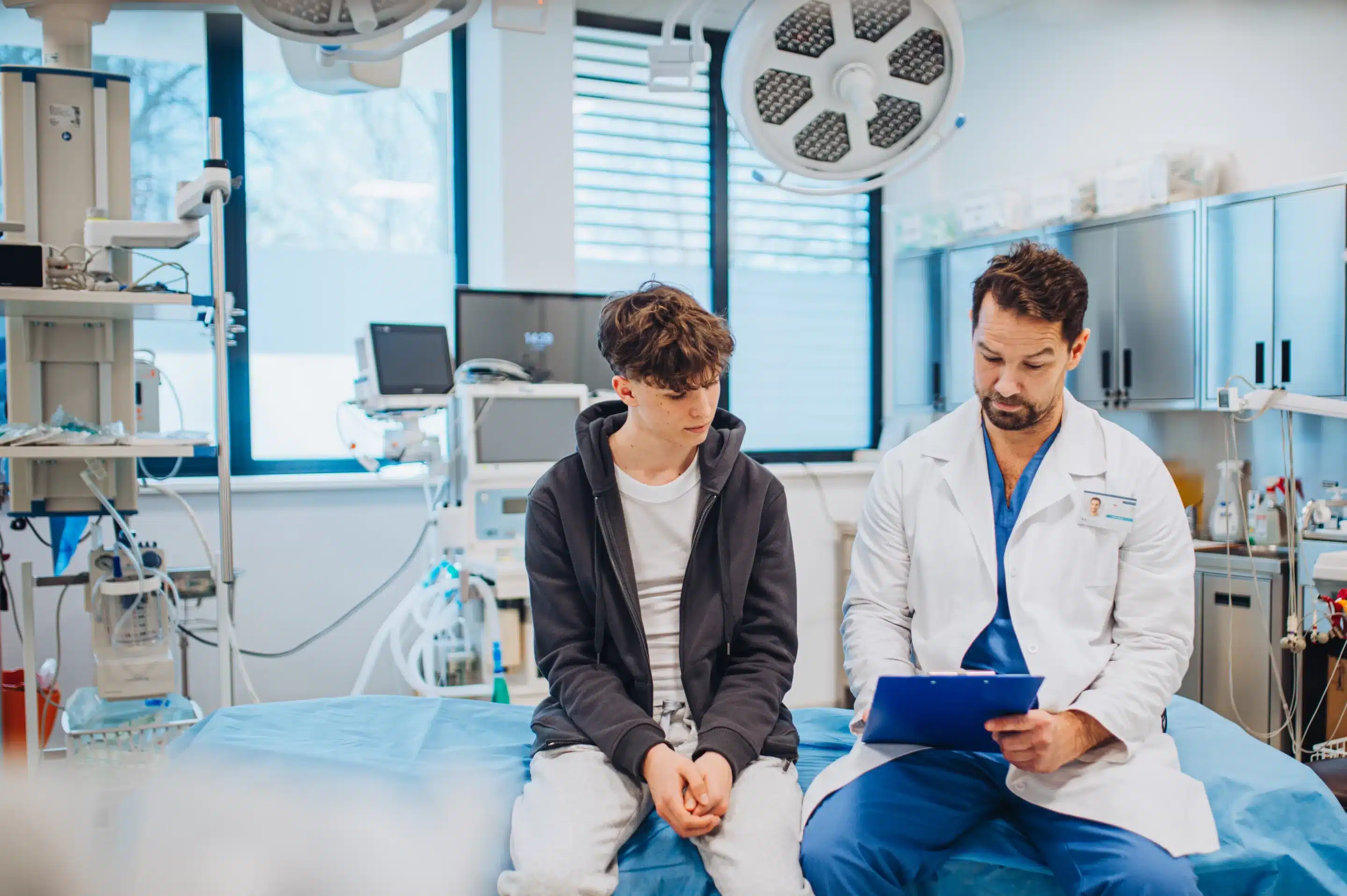 Empathetic doctor supporting teenage patient during health consultation