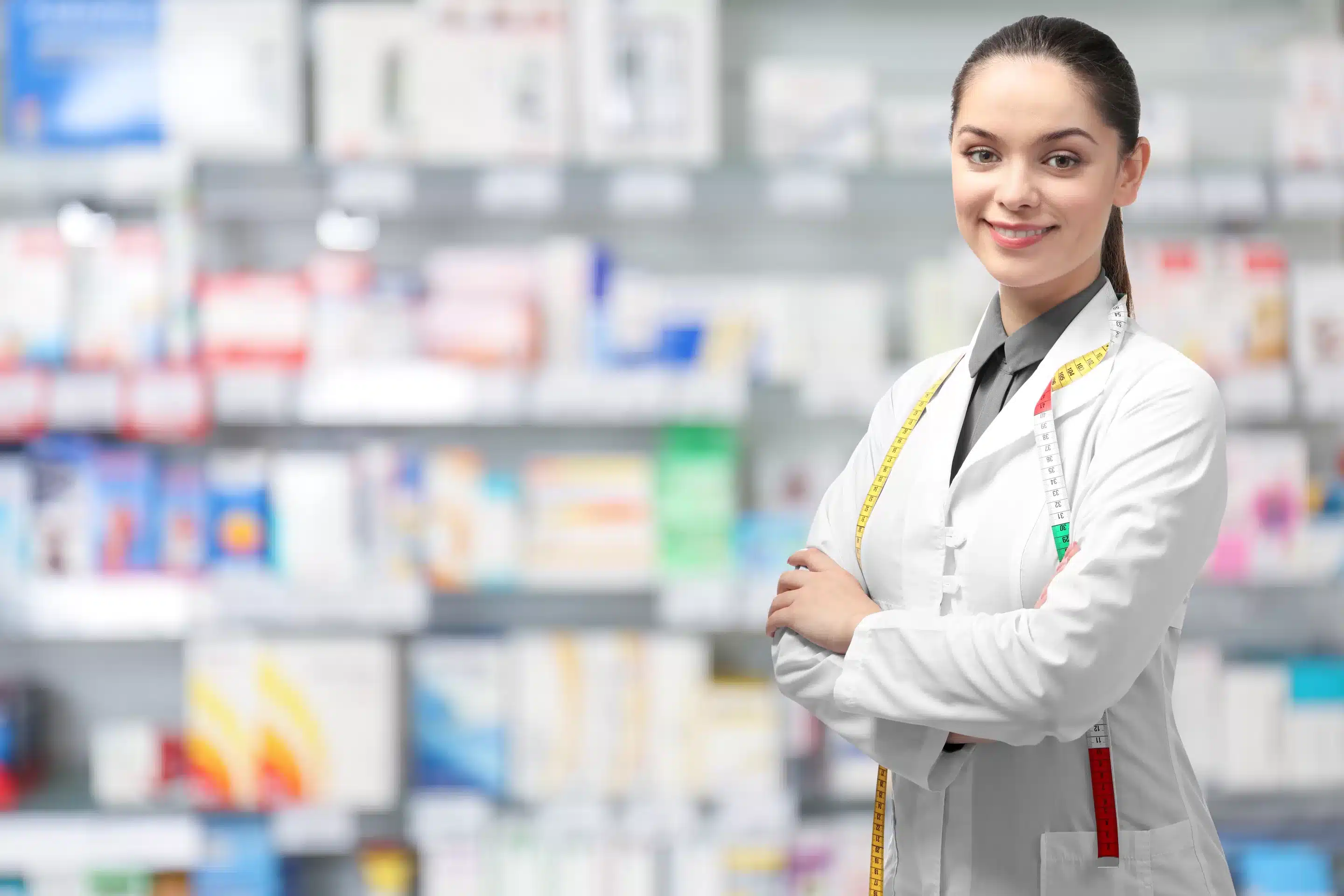 Nutritionist with measure tape at pharmacy