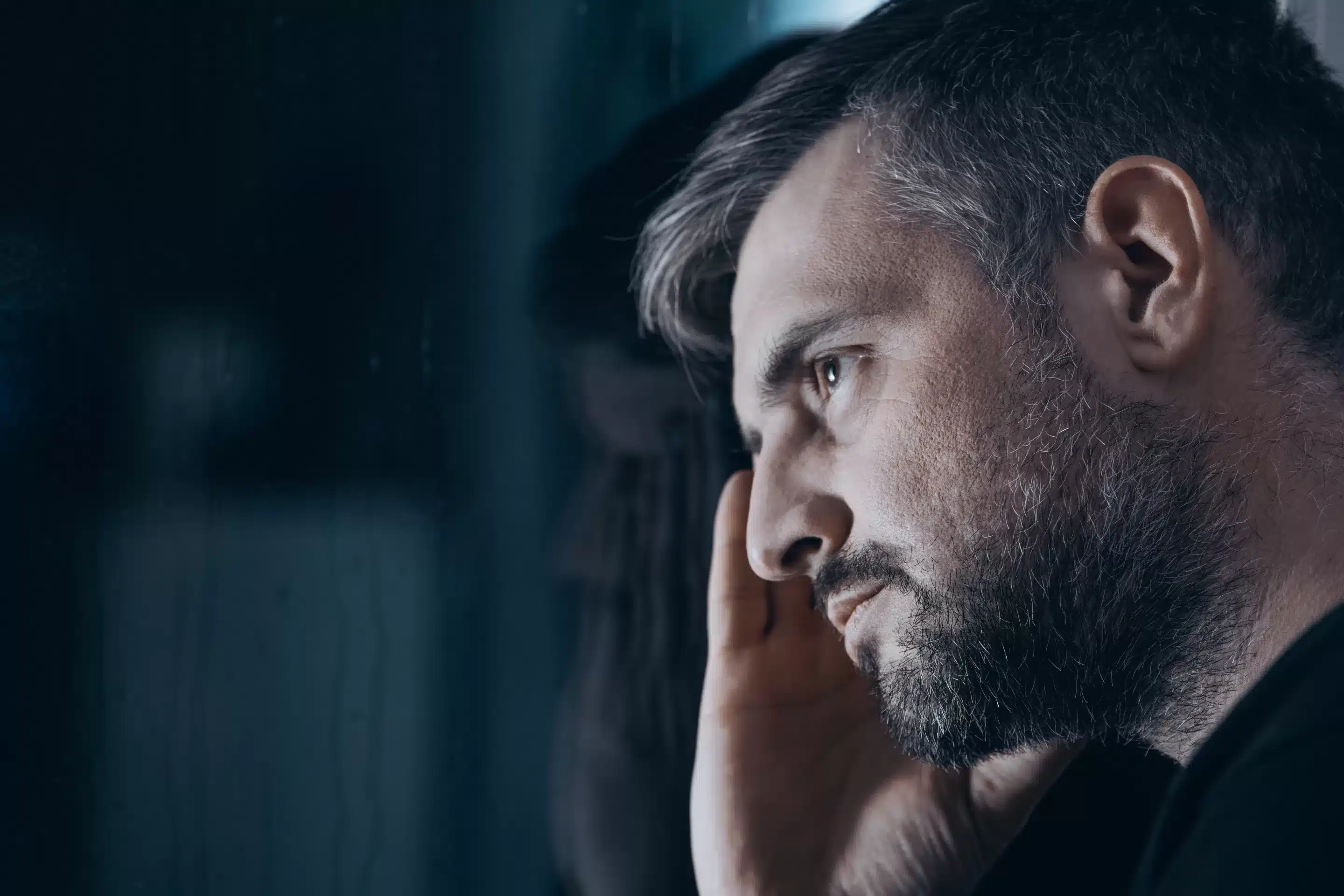 a man looking in a mirror