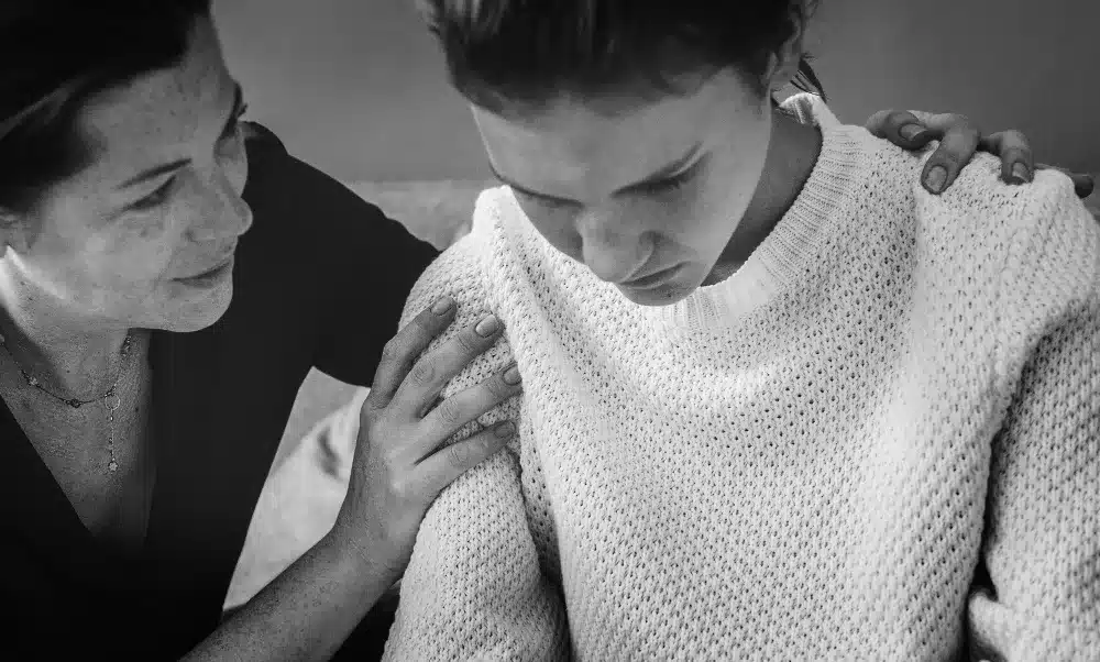 Woman comforting another lonely girl