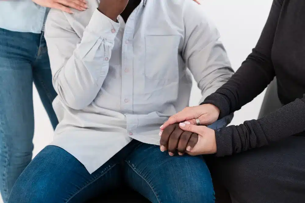 Female hands holding a  patient