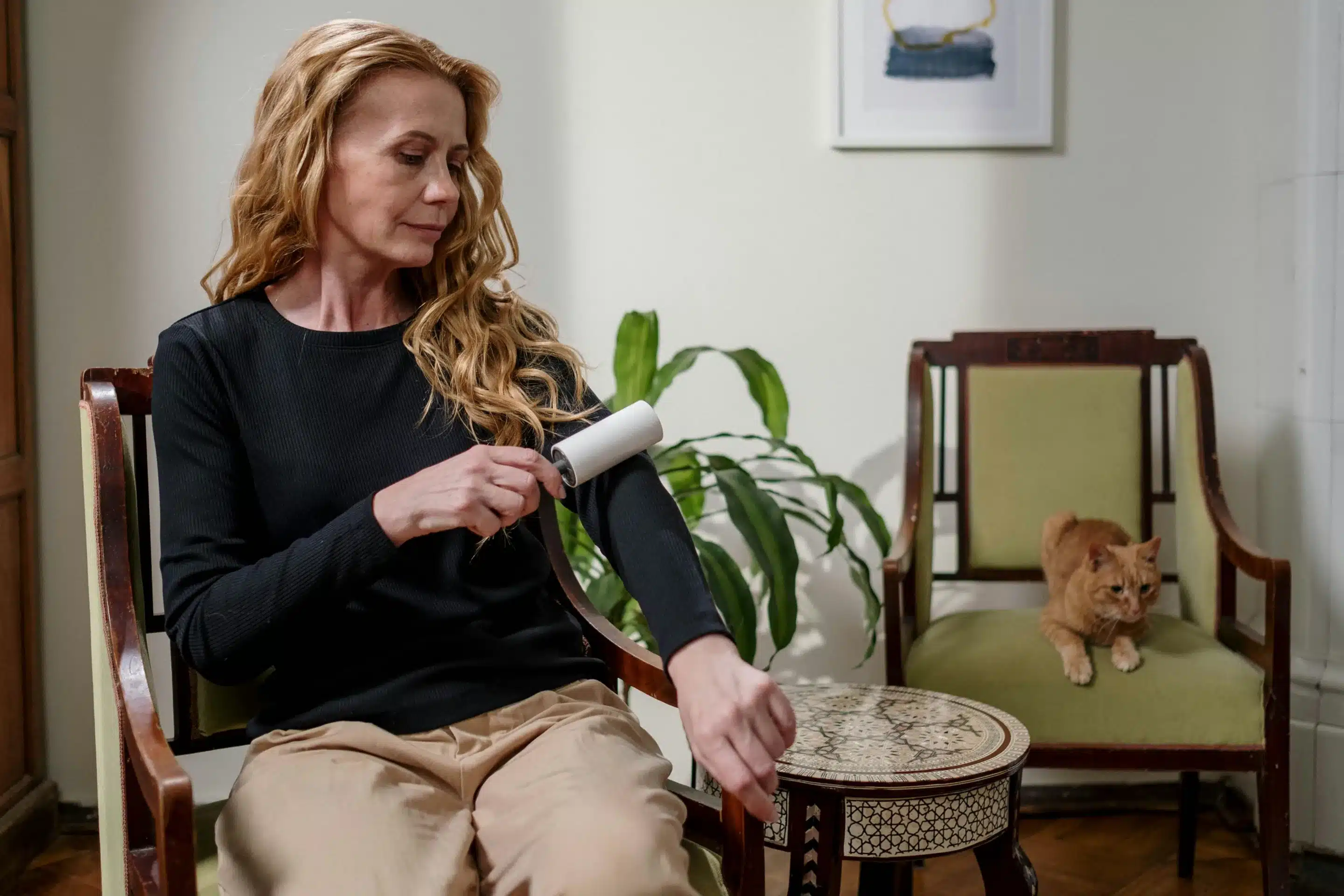 Woman using a lint roller.
