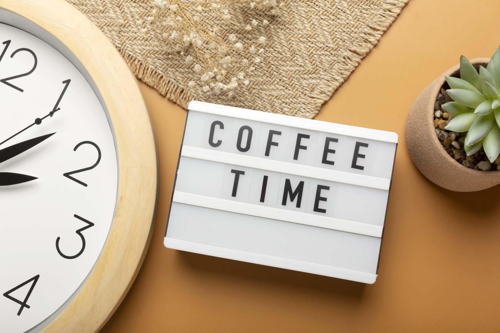 Still life arrangement of coffee time with a lightbox and coffee accessories
