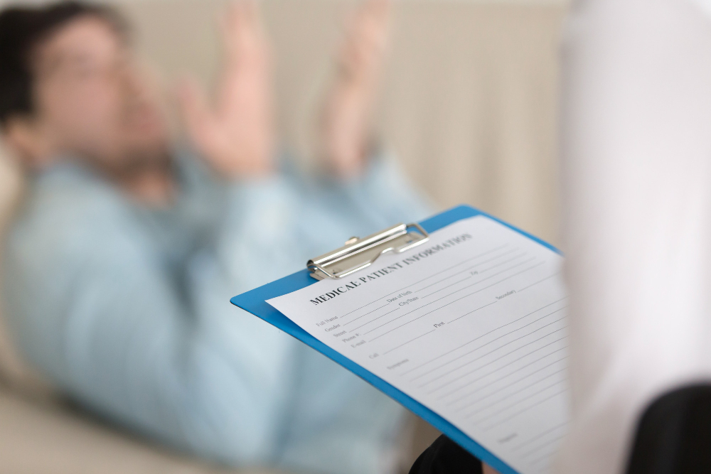 Female psychologist holding a clipboard in a professional therapy office setting</p>
<p>