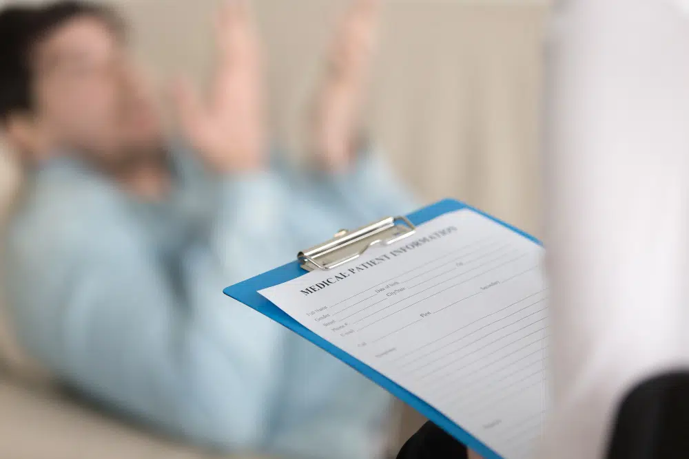 Female psychologist holding a clipboard in a professional therapy office setting</p>
<p>